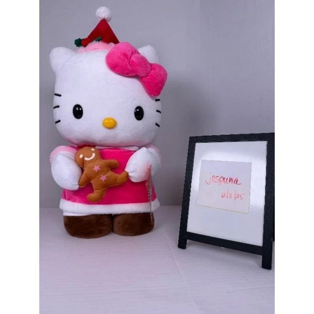 NWT -‎ Hello Kitty holding Gingerbread Cookie Christmas Greeter-CVS 2025